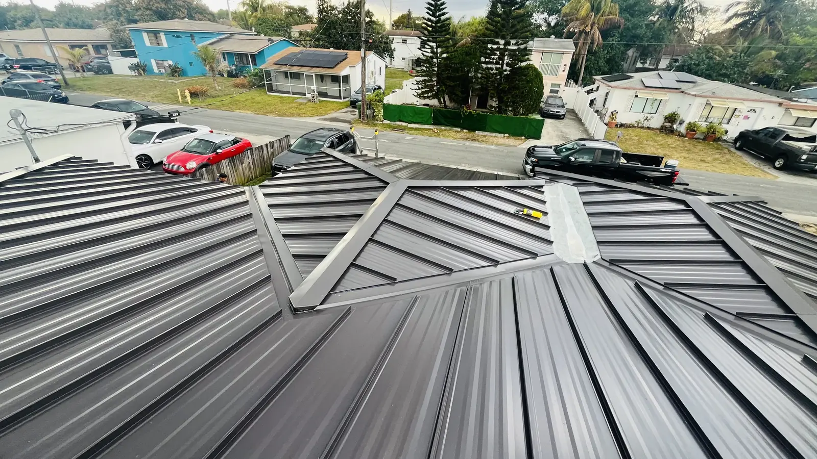 Completed dark standing-seam metal roof in Boca Raton, Florida